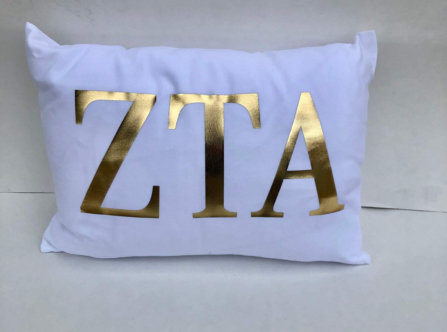 Zeta Tau Alpha White Pillow with Gold Letters